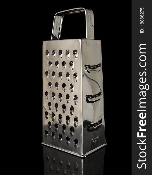 Shiny stainless steel grater isolated on black background