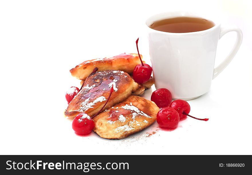 Pancakes with jam and cup of tea