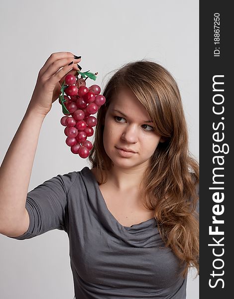 Girl With Grapes In His Hand