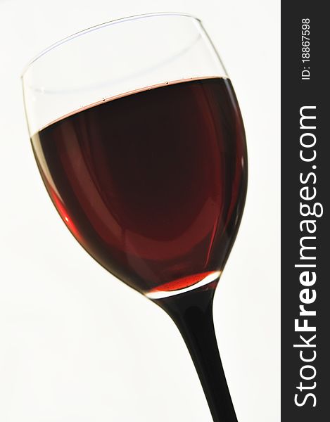 Red wine in glass glasses on the white isolated background