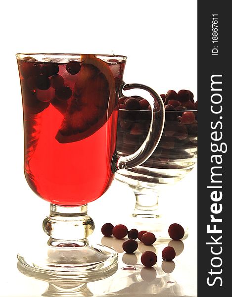 Fruit cocktail in glass glasses on the white isolated background