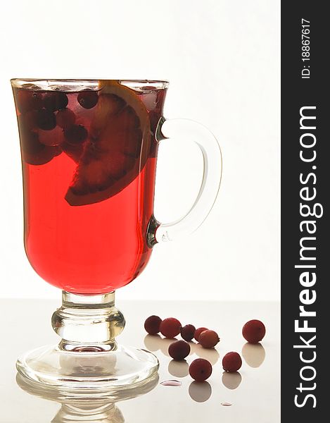 Fruit cocktail in glass glasses on the white isolated background