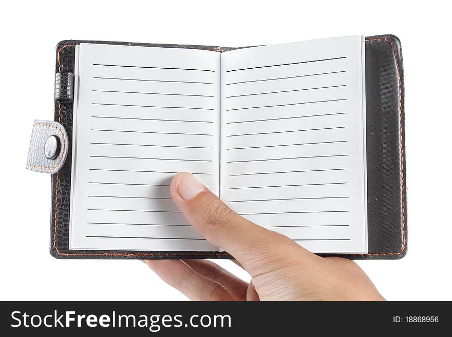 Hand holding a notebook on a white background