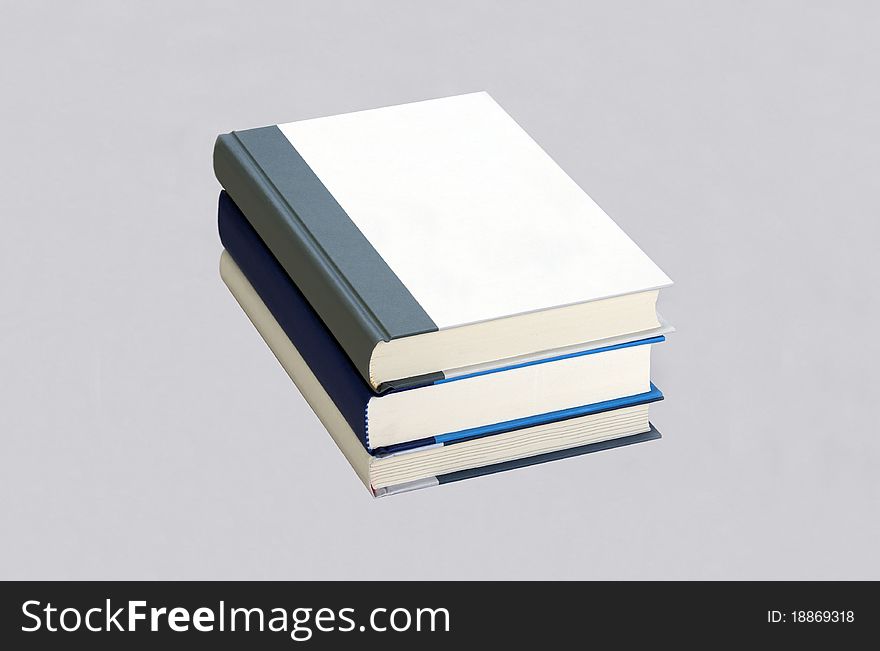 Three Plain Books In The Stack