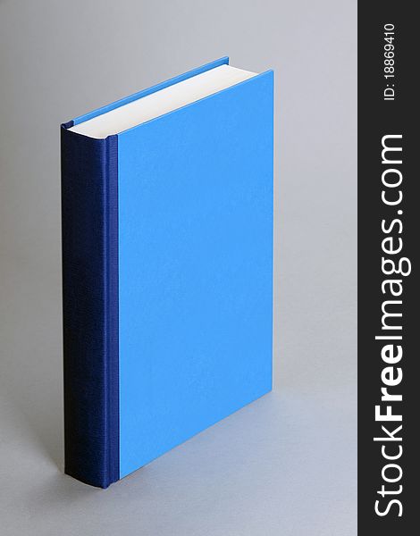 Plain blue book isolated on grey background. Plain blue book isolated on grey background