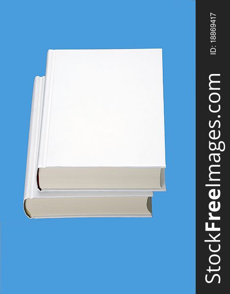 Two white books isolated on blue background. Two white books isolated on blue background