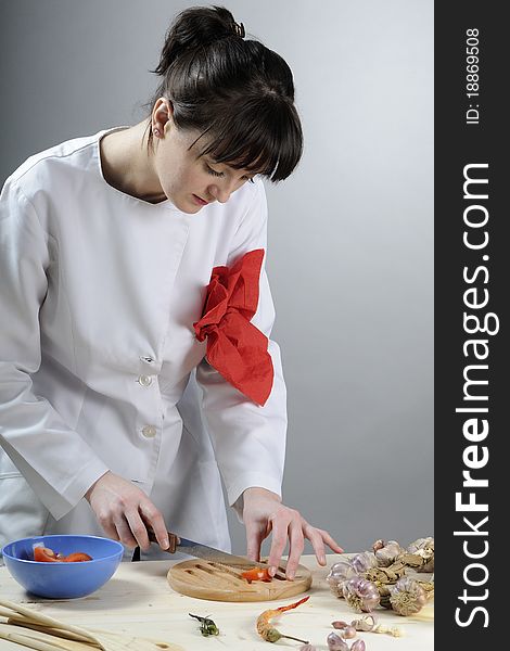 Young chef preparing healthy food in kitchen. Young chef preparing healthy food in kitchen