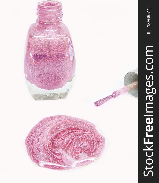 Pink nail polisher pouring isolated on white