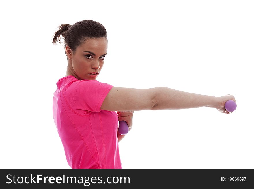 A young female holding weights in an outstretched arm. A young female holding weights in an outstretched arm