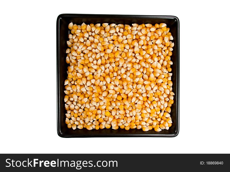 Picture of several mais corn og a black plate. Picture of several mais corn og a black plate