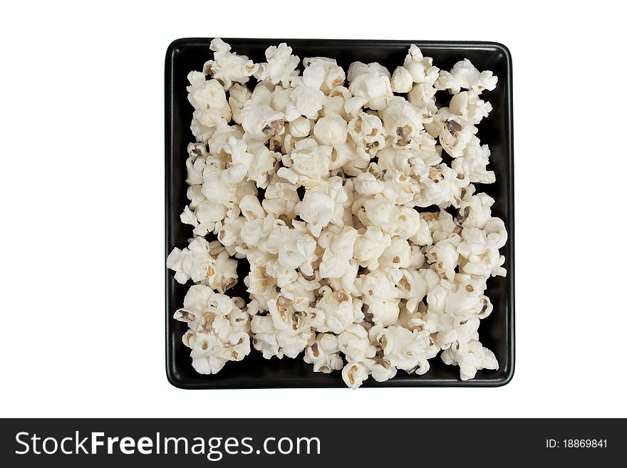 Picture of popcorn on a black plate. Picture of popcorn on a black plate