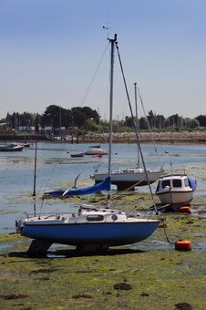 Yachts On The Mud At Low Tide. Stock Photo Yachts On The Mud At Low Tide. Stock Photo