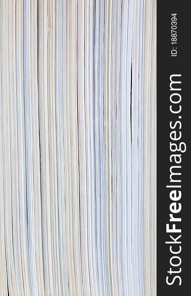 Magazines in a vertical stack to create a multi-colored stiped texture. Magazines in a vertical stack to create a multi-colored stiped texture.