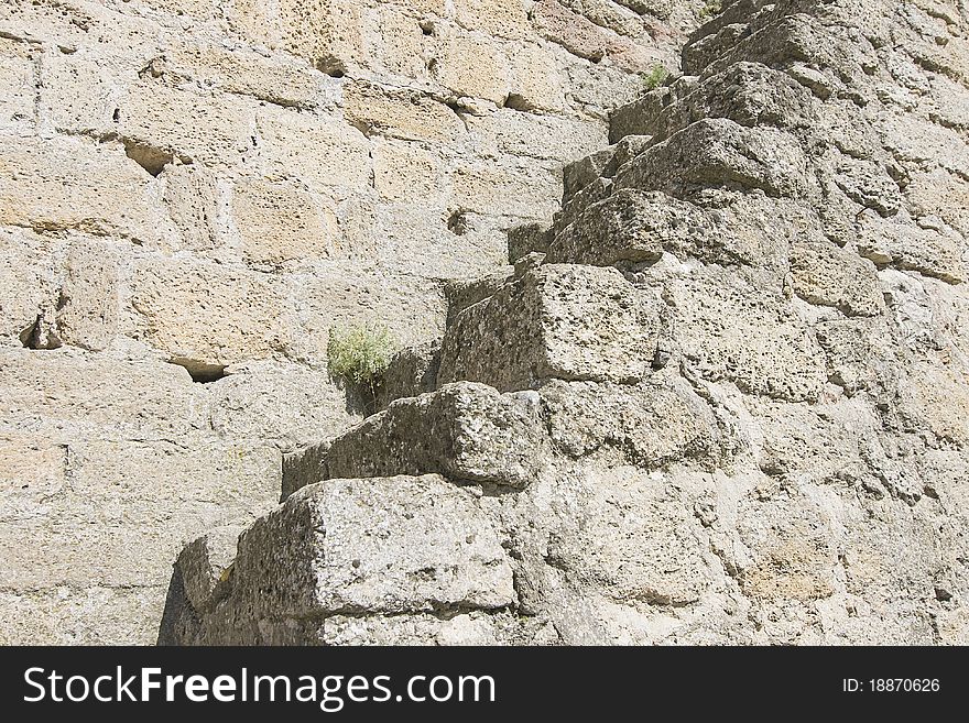 Stone ladder on an old medieval wall. Stone ladder on an old medieval wall