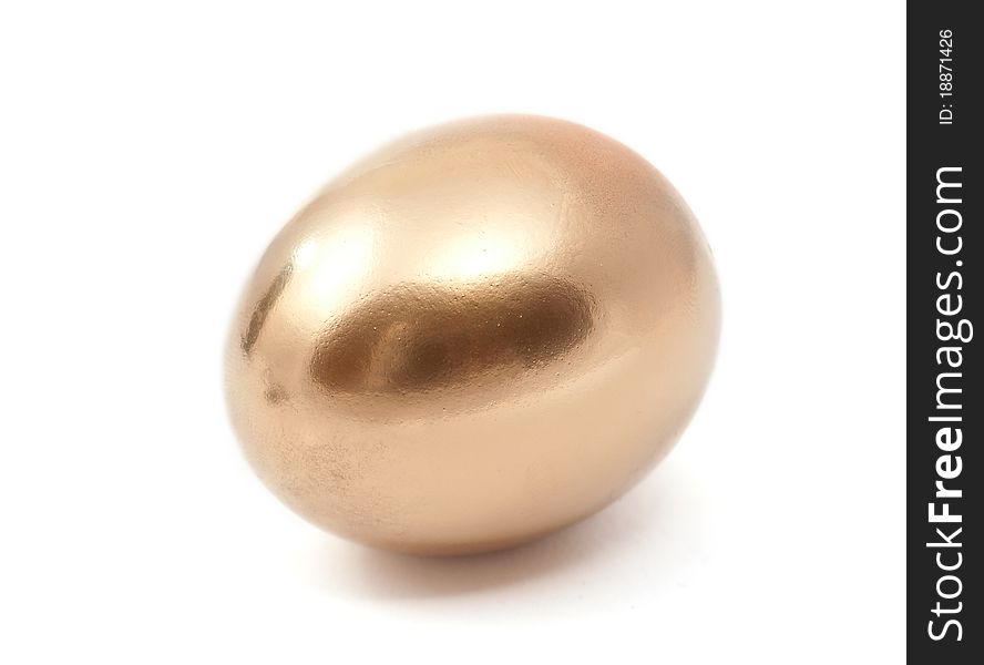 Golden egg on a white background