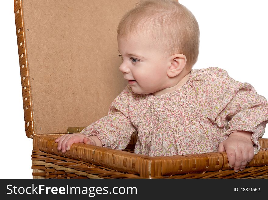 Closeup portrait of little cute baby girl in basket. Isolated on white. Closeup portrait of little cute baby girl in basket. Isolated on white