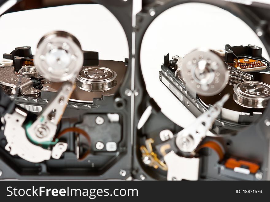 Opened hard disks on white background. Studio shot