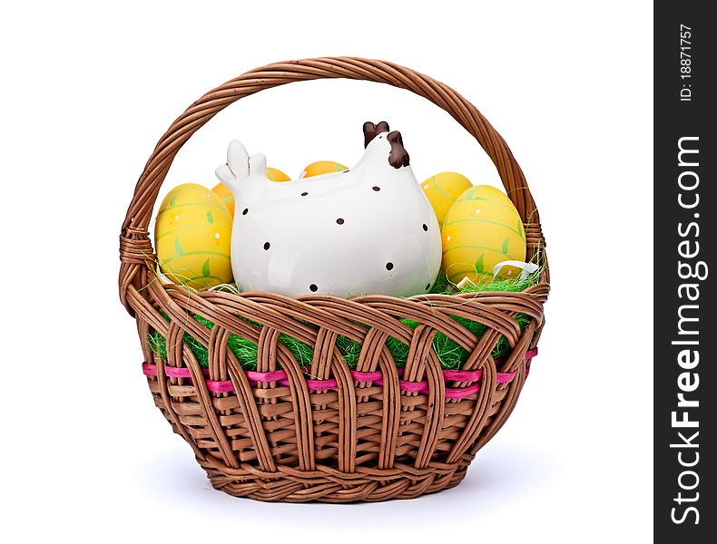 Woven basket full of eggs. Isolated on a white background. Woven basket full of eggs. Isolated on a white background.