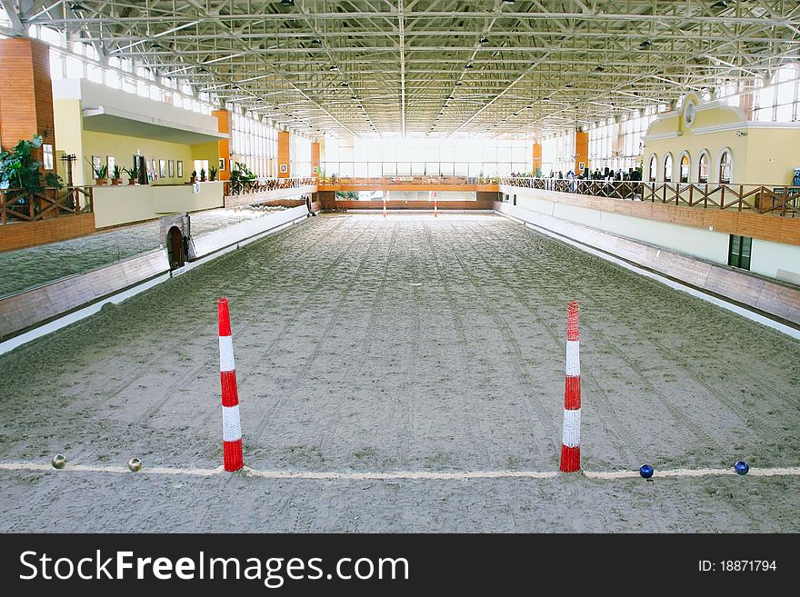 The image of a hall with polo field