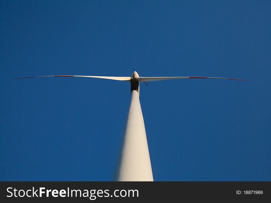 Wind turbine - blue sky - view from below