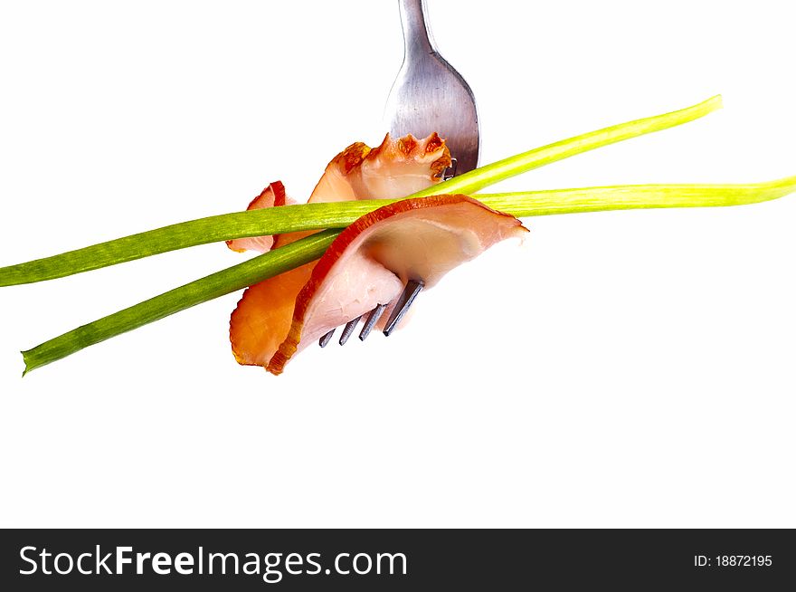 Delicious sausage on a fork on white background