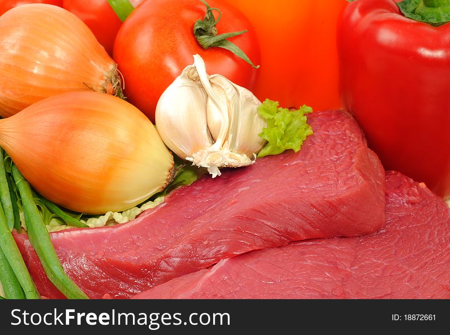 Vegetables and raw beef, close up shoot. Vegetables and raw beef, close up shoot