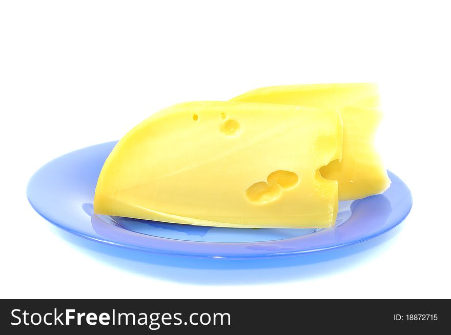 Fresh yellow cheese on blue plate, isolated on white