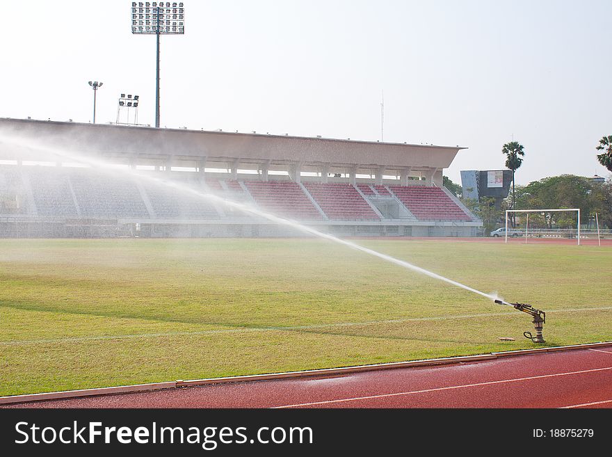 Nozzles are watering the field. care watering soccer fields.