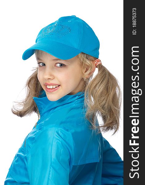 Portrait of a cute young girl standing on the blue cap and sport clothe over white background. Portrait of a cute young girl standing on the blue cap and sport clothe over white background