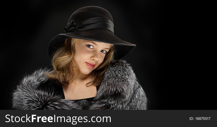 Portrait beautiful young lady in grey fur and hat