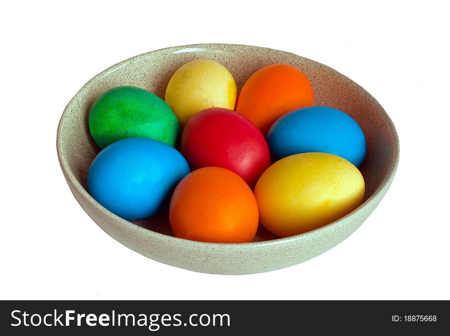 Colorful easter eggs in ceramic bowl isolated on white background