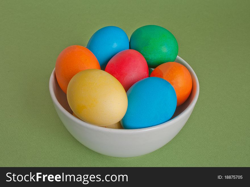 Easter eggs in ceramic bowl isolated on white background