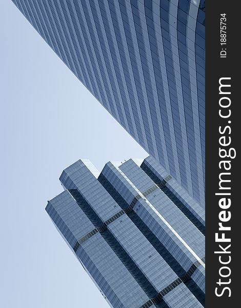 View of modern blue colored building on blue sky back. View of modern blue colored building on blue sky back