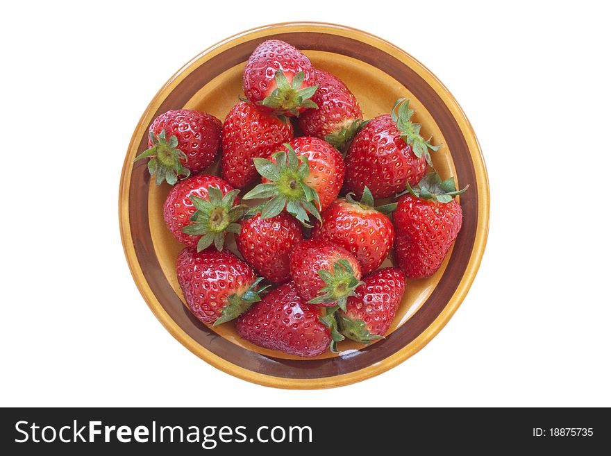Fresh ripe strawberry on ceramic plate isolated over white background