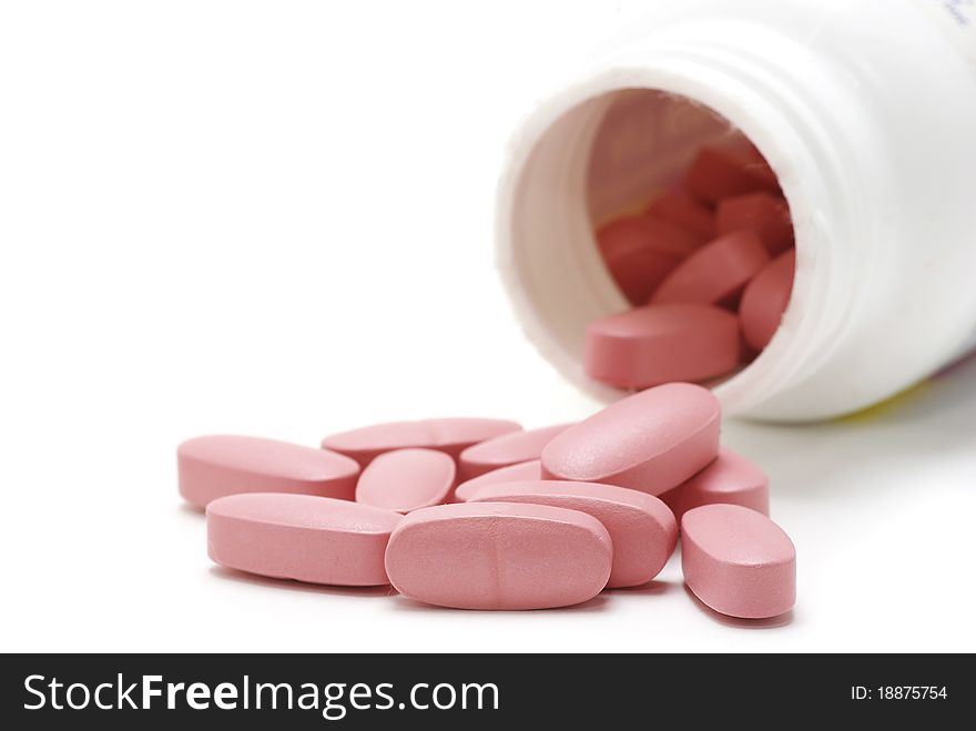 Macro of pills isolated on white background