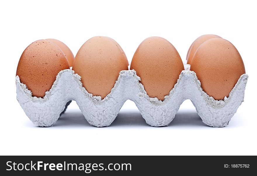 Eggs in container isolated on white