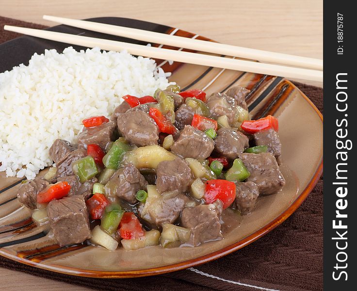 Sweet and sour beef with peppers and rice