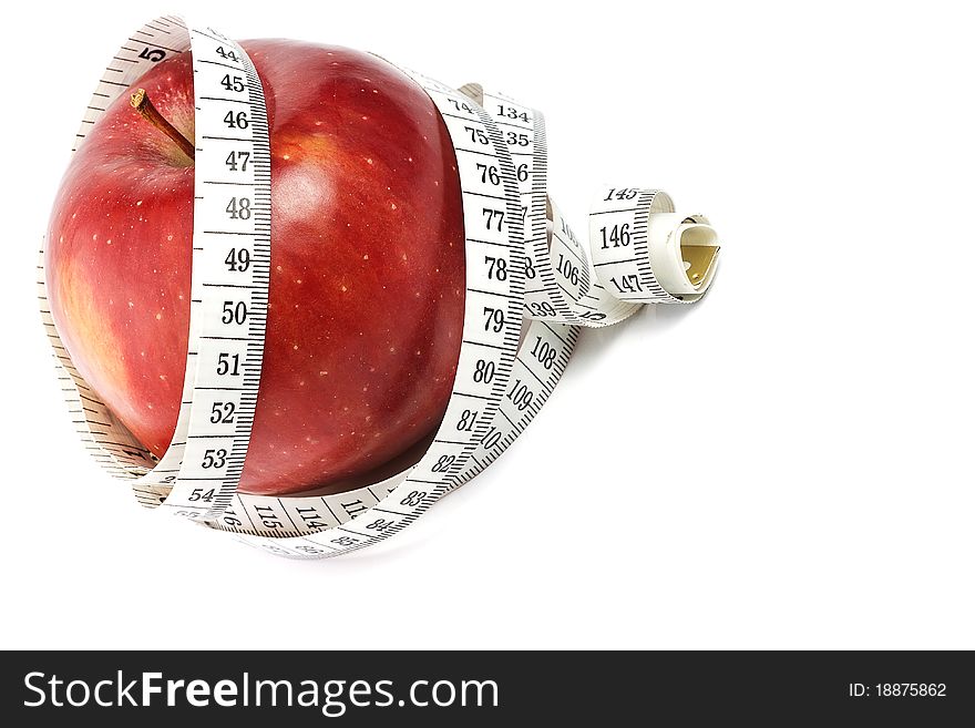 Red apple and measure tape isolated over white