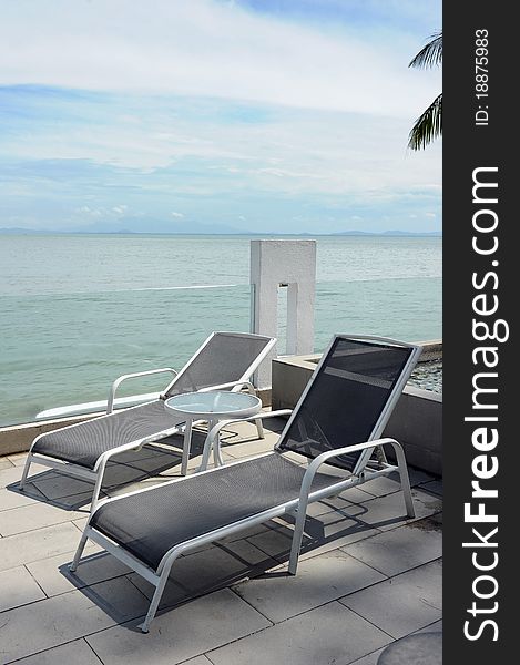 A relaxing chair inside a sea view hotel.