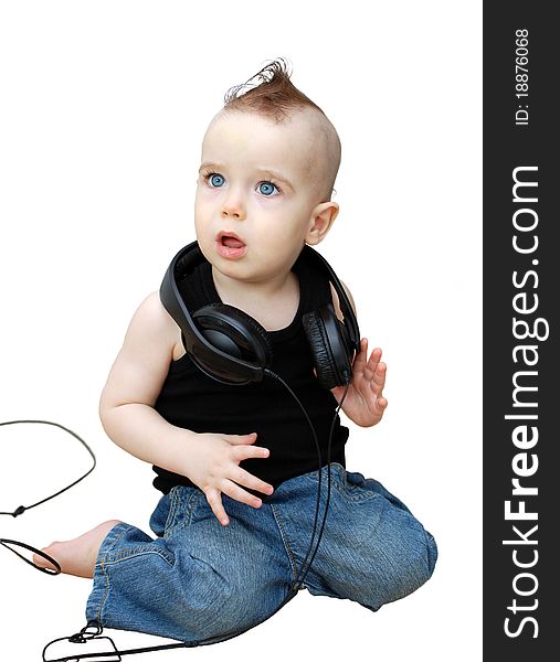 Portrait of serious baby in the earphones. Portrait of serious baby in the earphones
