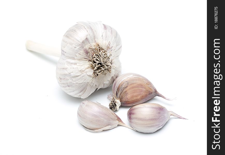 Garlic cloves on white background