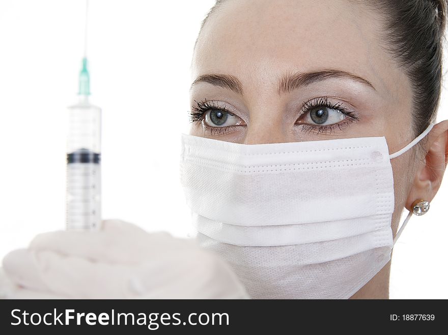 Treatment. The Doctor Holds A Syringe.