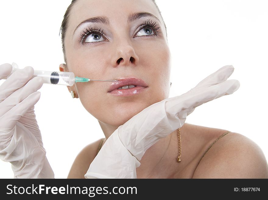 Cosmetic treatment with botox injection. White isolated. Cosmetic treatment with botox injection. White isolated.