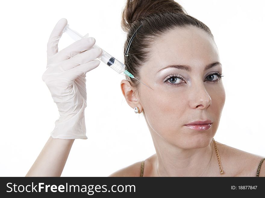 Cosmetic treatment with botox injection. White isolated. Cosmetic treatment with botox injection. White isolated.