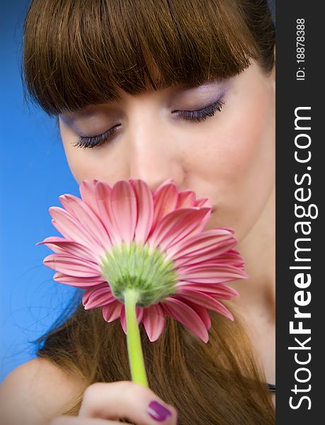 Portrait of a beautiful woman with a flower