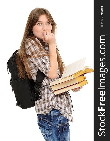 Girl with a backpack and books, is surprised; on a white background. Girl with a backpack and books, is surprised; on a white background