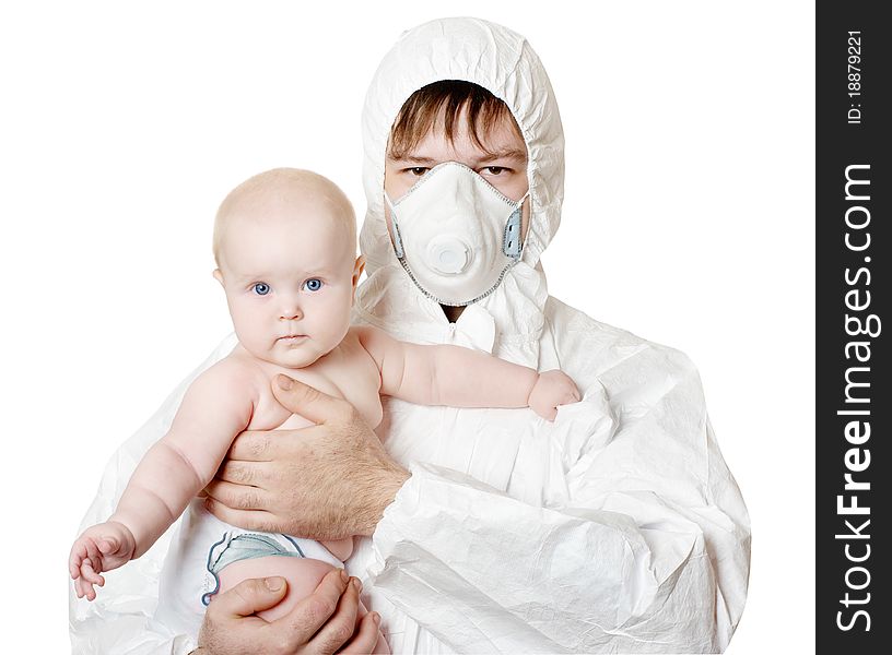 The man in protective clothes and a respirator holds the baby on hands. The man in protective clothes and a respirator holds the baby on hands