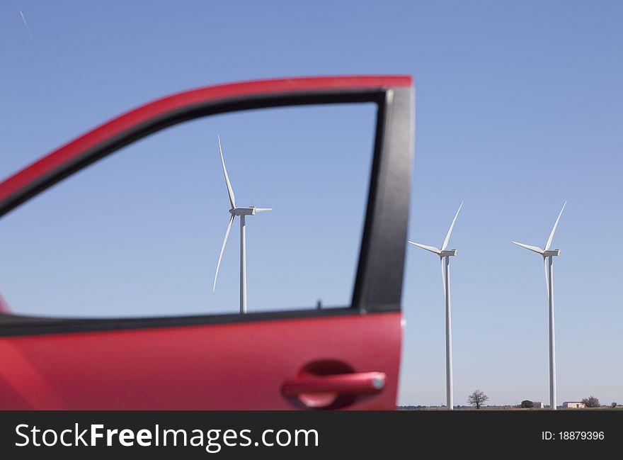 Green energy through the window of a gasoline car