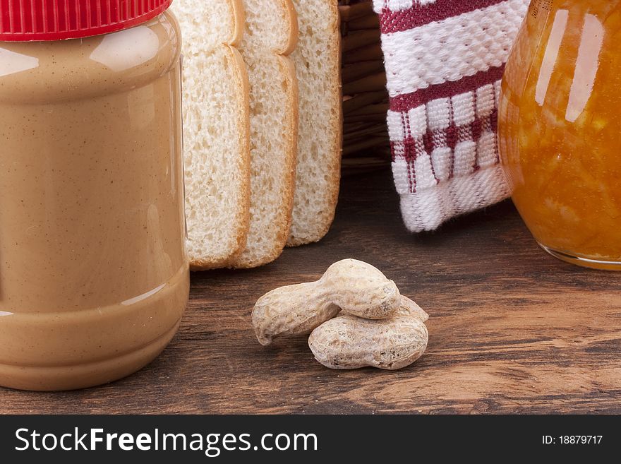 The plastic container with Peanut butter for sweet sandwiches.