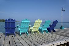 Colorful Chairs On Pier Royalty Free Stock Images